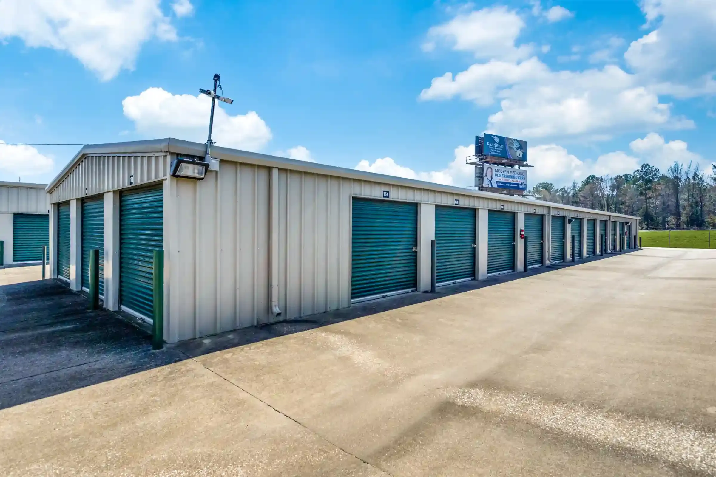 row of self storage units with drive up access and roll up doors