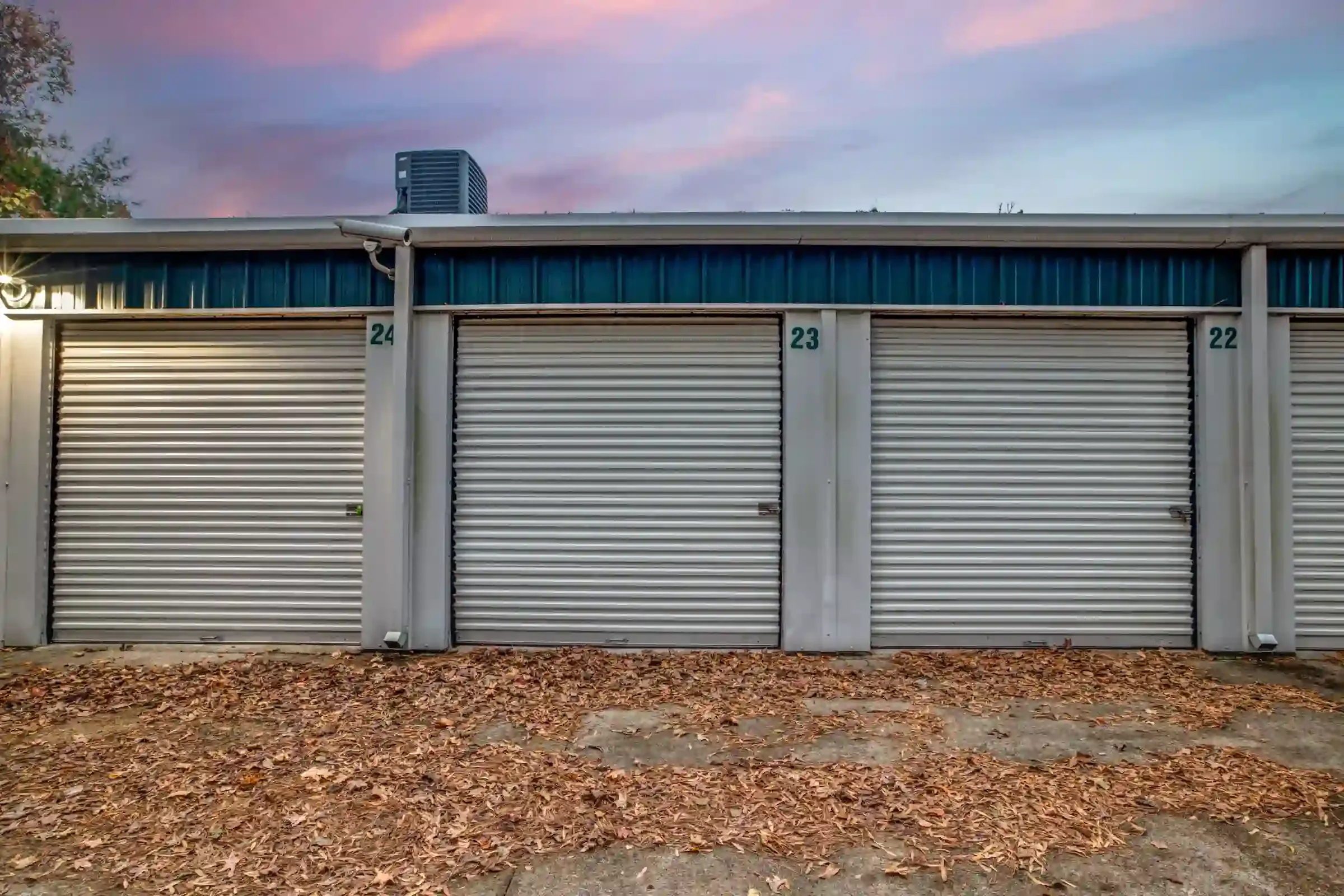 outside a storage facility with roll up doors and drive up access