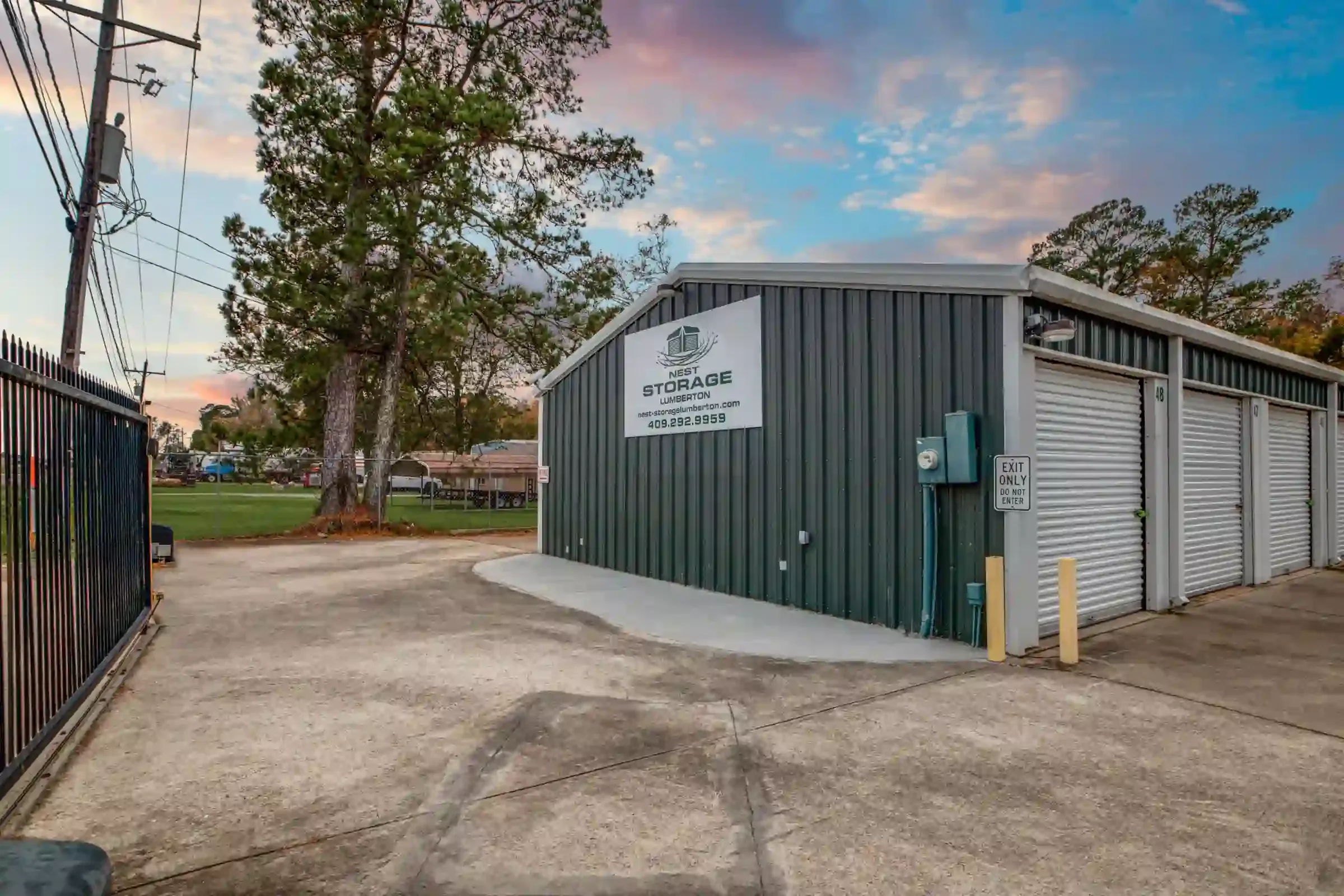 fenced storage facility with roll up doors and drive up access