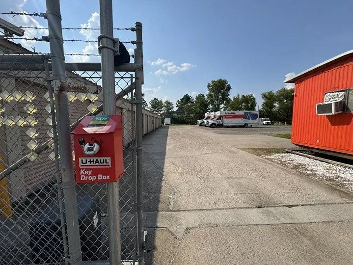 Stor-It-4 Less gated entry and view of U-Haul trucks