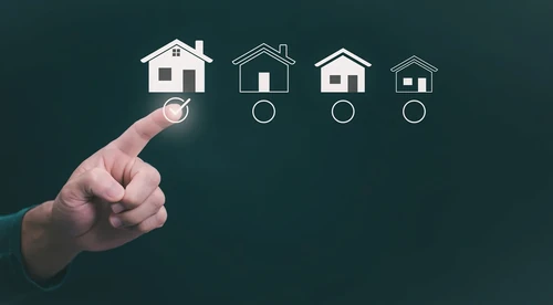 A person choosing a house icon with a finger to resemble choosing a space.