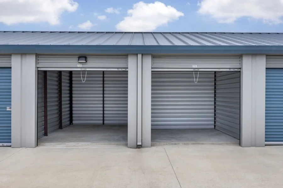 Self storage facility units with the doors open.