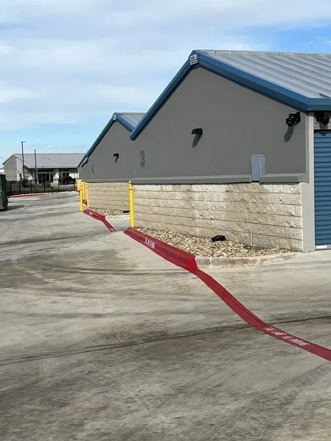 Outside concrete driveway of a self storage facility.